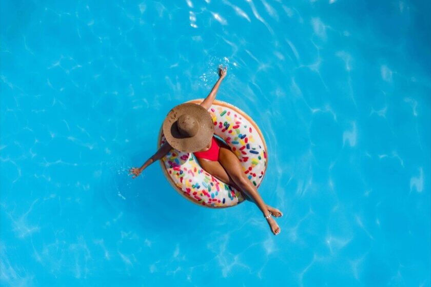 Woman on float in clean pool